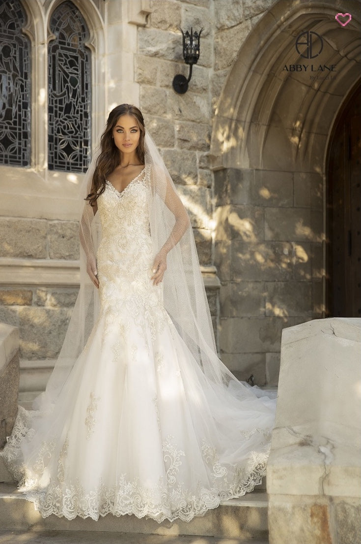 EMBROIDERED TULLE MERMAID BRIDAL GOWN WITH OPEN BACK COVERED BUTTONS AND TRAIN BY ABBY PARIS 97110