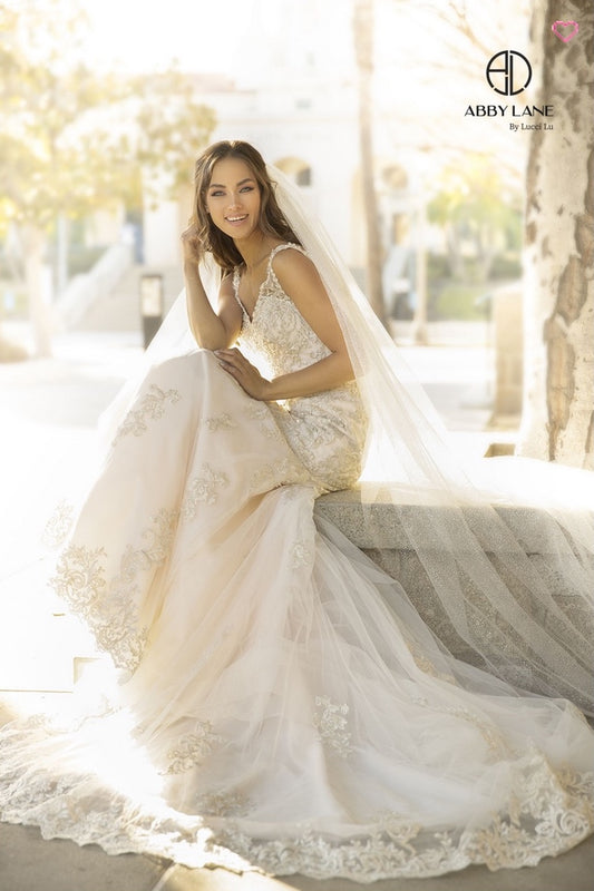 EMBROIDERED TULLE MERMAID BRIDAL GOWN WITH OPEN BACK COVERED BUTTONS AND TRAIN BY ABBY PARIS 97110