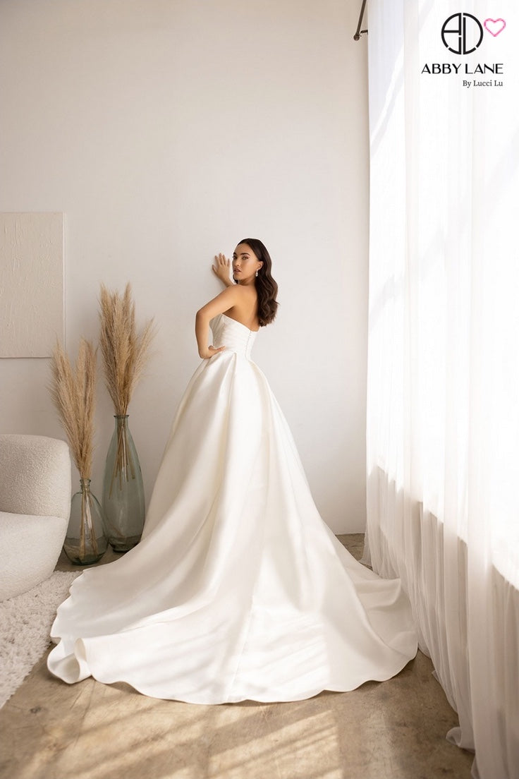SLEEK MIKADO SATIN STRAPLESS BRIDAL GOWN PLEATED POINTED BODICE WITH COVERED BUTTONS + TRAIN BY ABBY LANE 97178