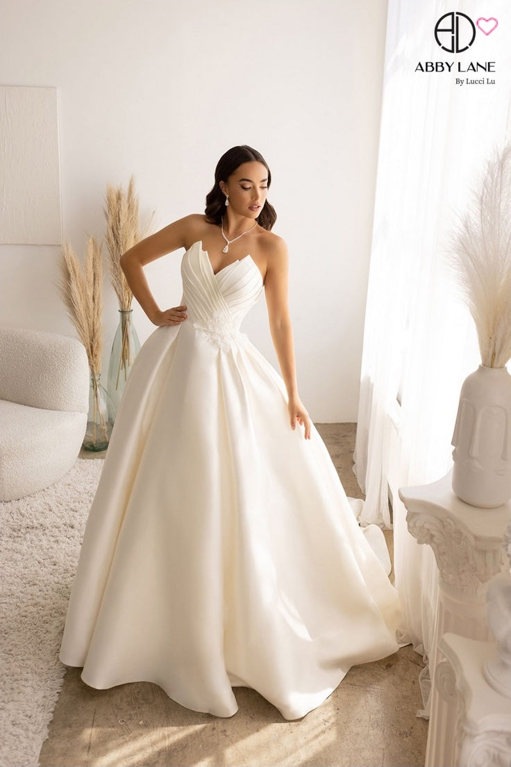 SLEEK MIKADO SATIN STRAPLESS BRIDAL GOWN PLEATED POINTED BODICE WITH COVERED BUTTONS + TRAIN BY ABBY LANE 97178