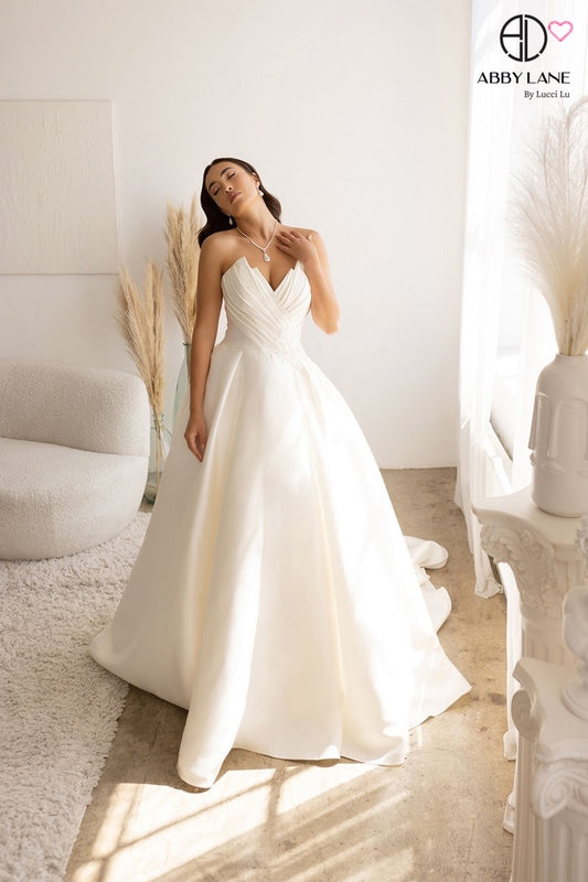 SLEEK MIKADO SATIN STRAPLESS BRIDAL GOWN PLEATED POINTED BODICE WITH COVERED BUTTONS + TRAIN BY ABBY LANE 97178