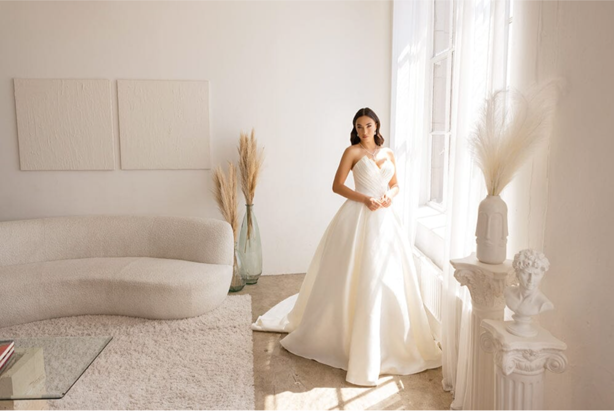 SLEEK MIKADO SATIN STRAPLESS BRIDAL GOWN PLEATED POINTED BODICE WITH COVERED BUTTONS + TRAIN BY ABBY LANE 97178