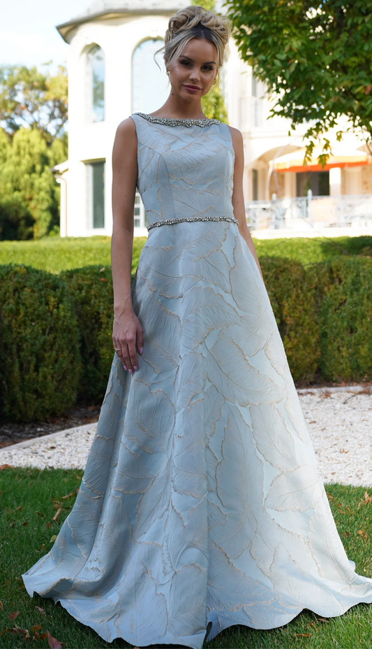 ELEGANT JACQUARD GOWN WITH JEWELED NECKLINE & BEADED WAISTBAND A-LINE SKIRT + POCKETS MARSONI BY COLORS DRESS MV1224